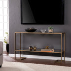 Consolle con finitura oro, piano in vetro e ripiano a specchio