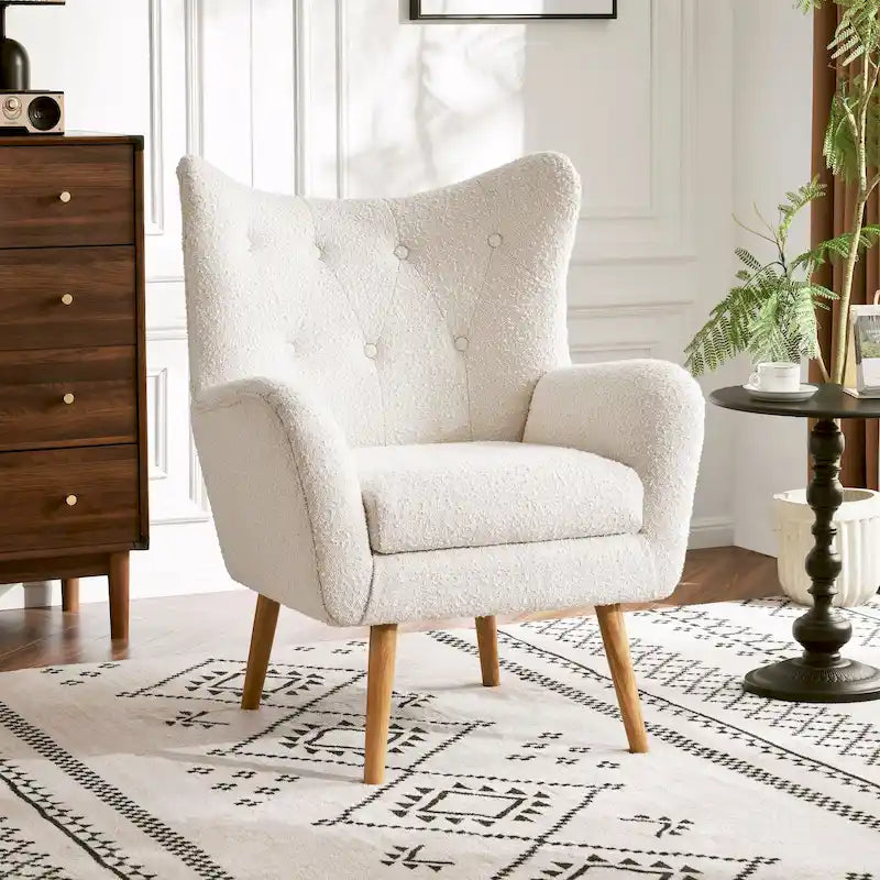Poltrona club tufted con schienale ad alette Bouclé mandorla