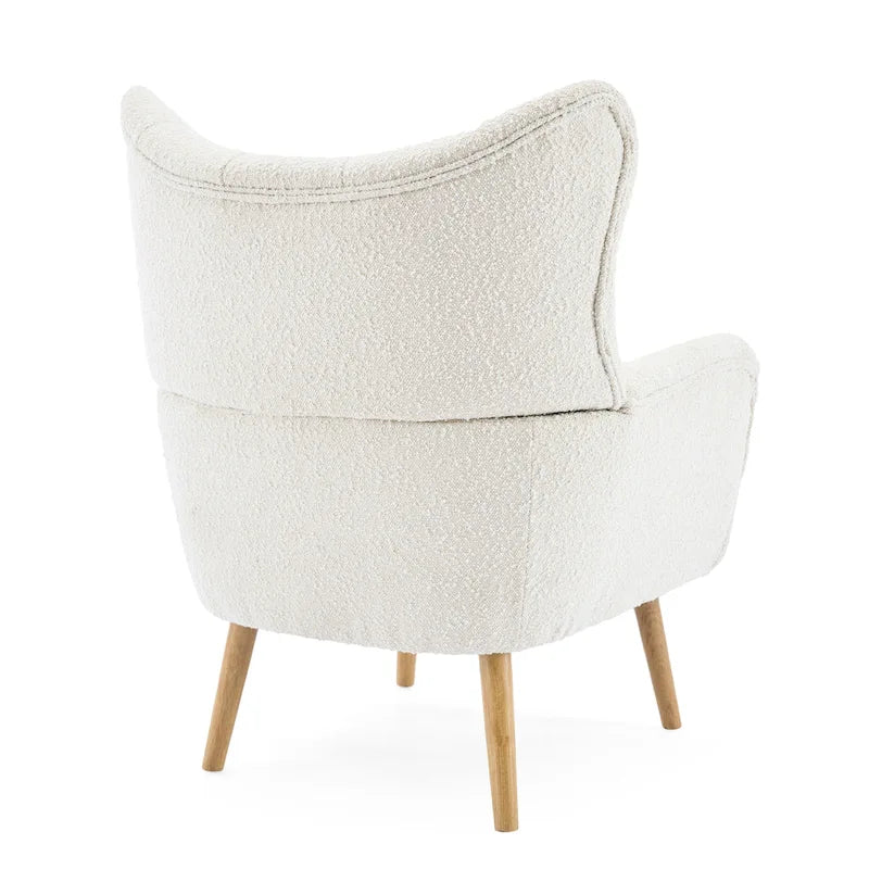 Poltrona club tufted con schienale ad alette Bouclé mandorla