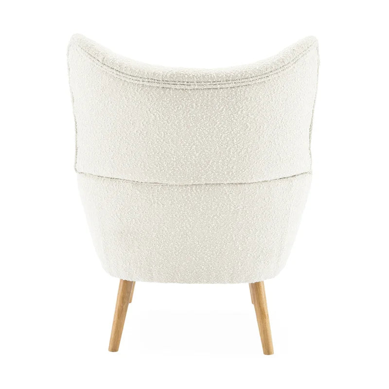 Poltrona club tufted con schienale ad alette Bouclé mandorla