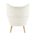 Poltrona club tufted con schienale ad alette Bouclé mandorla