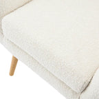 Poltrona club tufted con schienale ad alette Bouclé mandorla